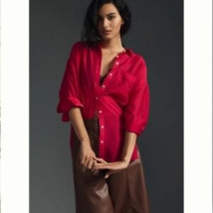 One pocket on the left side  Stylish plaid top in vibrant red and black. Perfect